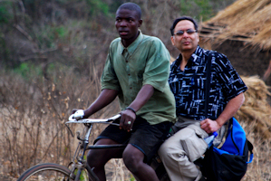 Dr. Arun Agarwaal rides on a bike to visit a remote village