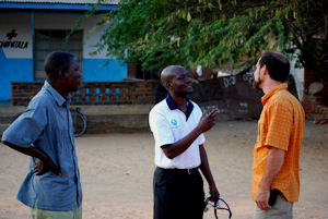 John Eastwood and Stanley Mateya meet with local doctor at his small clinic